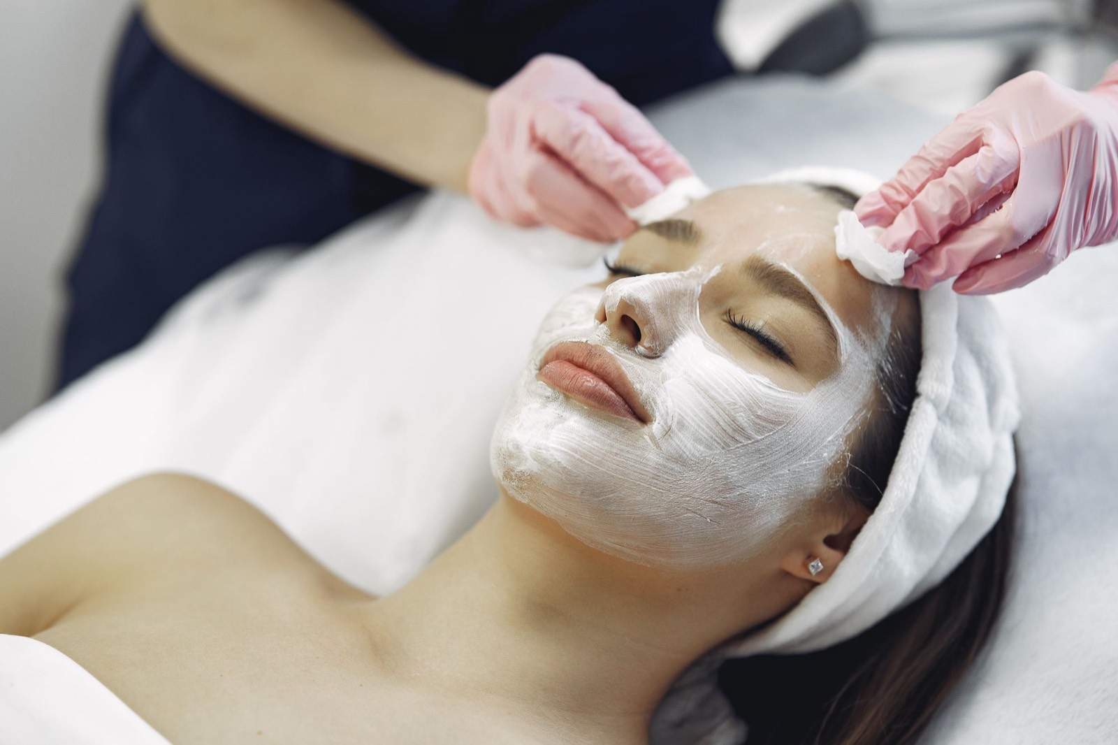 A calming treatment mask being applied during a skin rejuvenation session.